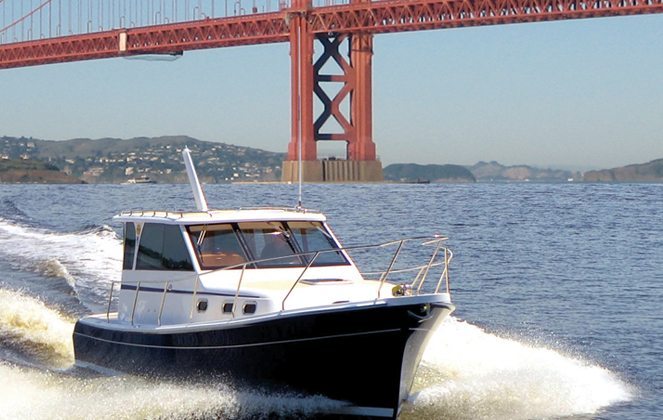 Powerboat crusing near Golden Gate Bridge