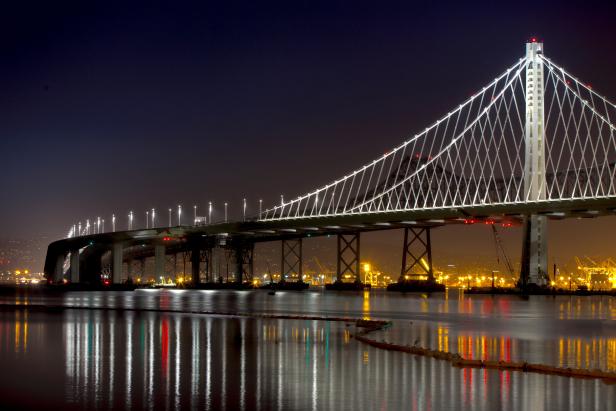 the new San Francisco Bay bridge at night from a sailboat