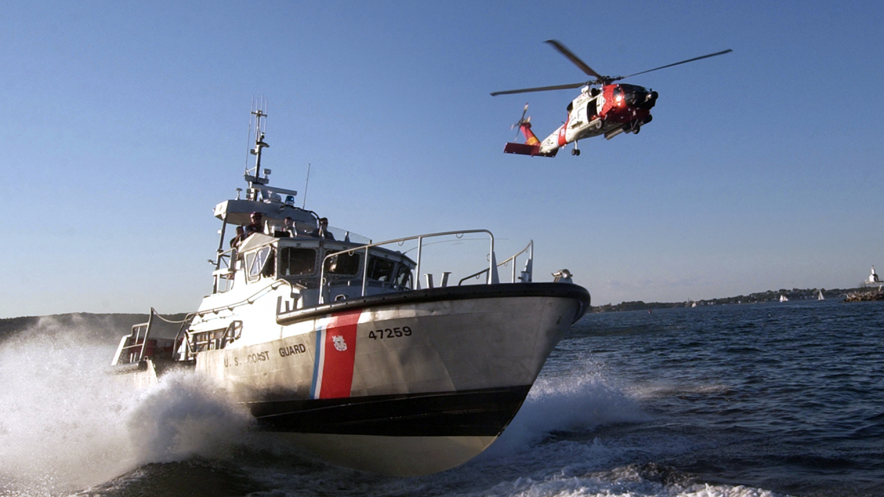 Coast Guard ship and helicopter